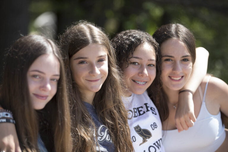 Four girls smiling