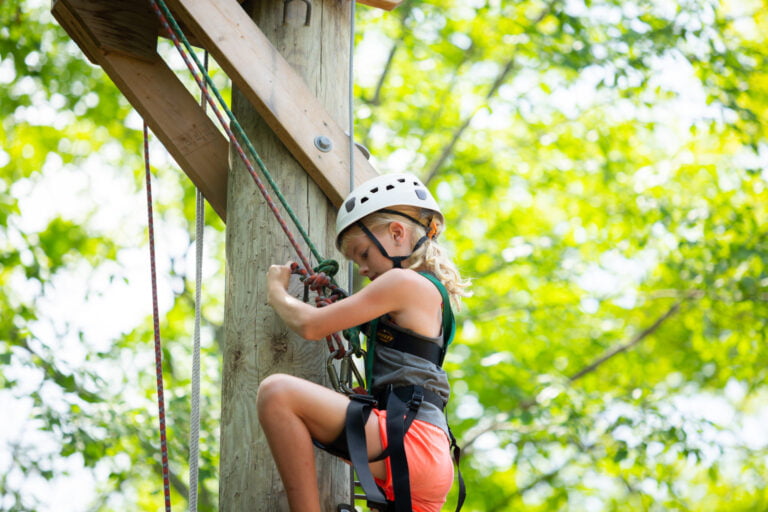 Girl climbing pole
