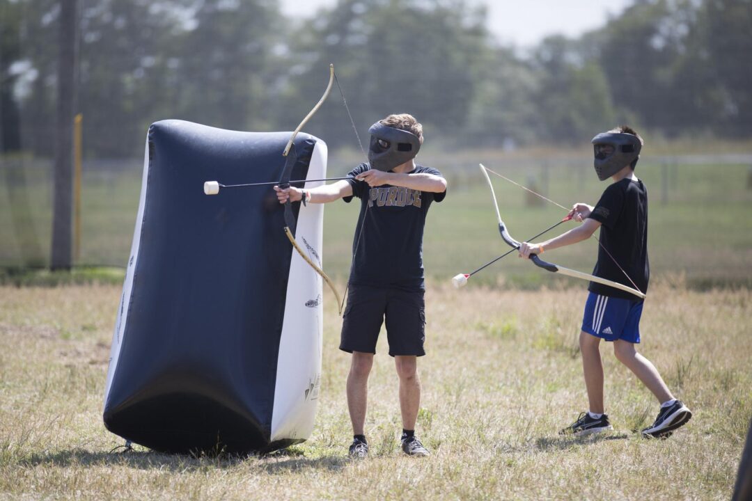 two boys with boys and archery tag arrows