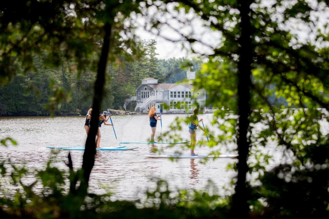 girls paddle boarding on Lake Rosseau